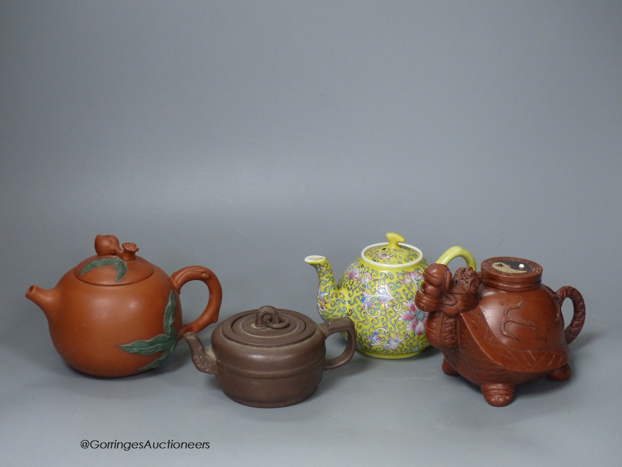 Three Chinese Yixing teapots and a yellow ground teapot, height 10cm